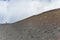 Person climbing on Mount Etna Vulcano Silvestri crater