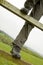 Person climbing over fence