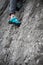 Person climbing while wearing rock climbing shoes