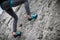 Person climbing while wearing rock climbing shoes