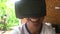 Person of color uses a VR virtual reality headset with big smile