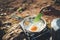 Person cooking fried eggs in nature camping outdoor, cooker prepare omelette breakfast picnic on metal gas stove, tourism recreat