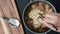 A person is cooking instant noodles in a meatball soup while the beef broth is boiling and steam is gushing out. Photo, top view,