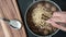 A person is cooking instant noodles in a meatball soup while the beef broth is boiling and steam is gushing out. Photo, top view,