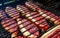 Person cooking raw steaks on a barbecue grill