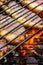 Person cooking steaks on a barbecue grill