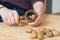 Person cracking walnuts - close-up