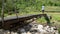 Person is Crossing a Footbridge