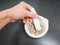 Person crushing brown sugar cubes