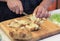 Person cutting Potatoes into small cubes