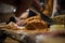 Person cutting tartar beef or tatar meat. Traditional dish being served on a table at a feast. Popular appetizer