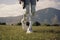 Person cyborg walking on mountain grass. Generate AI