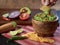 Person eating guacamole with corn toast vegetables and chili background