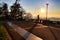 Person enjoying the panoramic view and sunset from Sanctuary of