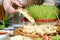 Person Enjoying a Slice of Pizza at a Pizza Parlor