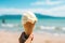 Person Enjoys Vanilla Gelato On Sunny Beach