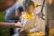 Person filling popcorn in a paper bag with a blurred background