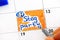 Person fingers with pen reminder Stag Party in calendar.