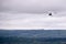 Person flying away into the horizon on a small aircraft single seat microlight as a hobby or sport in the air