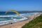 Person flying his paraglider on the beach of Wilderness, South Africa