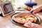 Person Following Pizza Recipe Using App On Digital Tablet