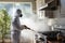 Person fumigating a kitchen to destroy cockroaches and other insects. Ai image