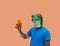 Person gesture with frog mask with an orange wipe or cloth to clean or dust concept cleaner on orange background