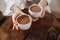 Person giving ceremonial cacao in cup. chocolate drink top view