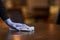 Person with gloves on cleaning and sanitizing a wooden table