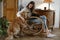 Person with golden retriever dog on rocking chair at home