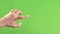 Person hand isolated on green background screen. Left hand on chroma key