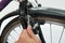 Person Hands Tightening Bolt Of Bicycle Tire