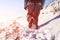 Person hiking on the mountaintop covered with snow low angle view