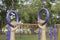 Person hold the blue hanging the outdoor exercise equipment in public park