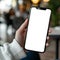 Person Holding Cell Phone With White Screen