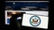 Person holding cellphone with seal of United States Department of State (DOS) on screen in front of webpage.