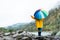 Person holding a colored umbrella. Rainy and wet weather.