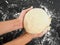 Person holding a dough after proofing