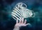Person holding fractal endangered zebra illustration 3D rendering
