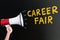 Person Holding Megaphone Near Career Fair Text