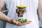 Person holding snails in jar