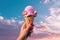 a person holding up a pink ice cream cone in the sunny sky, in the style of lush colors, eye-catching composition