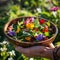 A person holding a wooden bowl full of vibrant edible flowers and greens, showcasing a fresh, organic, and colorful salad