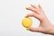 Person holding yellow macaroon