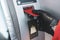 Person insert plastic credit card into street atm bank