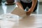 A person installing new vinyl tile floor, a DIY home project