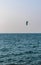 Person kite surfing in open sea. Sports