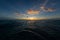 Person kitesurfing during the breathtaking sunset reflecting in the ocean in Bonaire, Caribbean