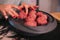 A person kneading minced meat