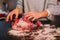 A person kneading minced meat